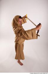 JOEL_ADAMSON WITH CRUCIFIX AND SWORD